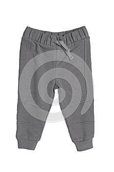 Childrens sportswear. Close-up of a gray kids baby sports sweatpants isolated on white background. Spring and autumn fashion pants