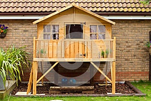 Childrens wooden treehouse in the garden