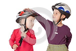Childs in bicycle helmets