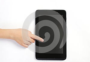 Childs finger showing on tablet on white background