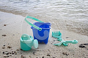 Childs green beach bucket and spades