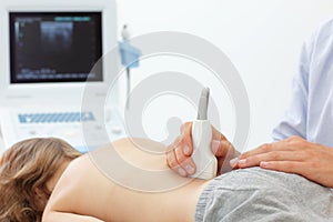 Childs lower back diagnosis with ultrasound