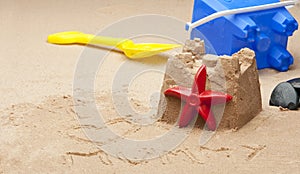 Childs sandcastle on beach.
