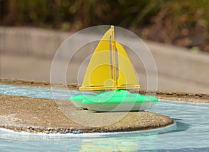 Childs toy boat in a pool