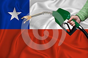 CHILE flag Close-up shot on waving background texture with Fuel pump nozzle in hand. The concept of design solutions. 3d rendering