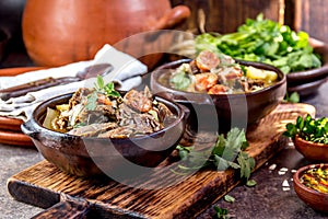 Chilean Ajiaco. Latin American food. Ajiaco - traditional chilean soup with grilled meat, onion and potato served in