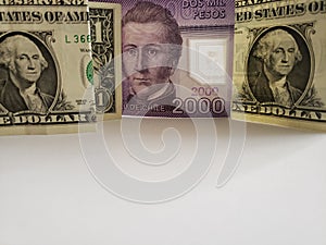 Chilean banknote of 2000 pesos and american one dollar bills
