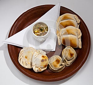 plate of empanadas with traditional chilean dressing photo