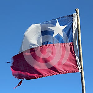 Chilean flag flying, small.Lonely Star. Broken flag