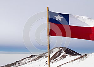 Chilean Flag on a Snowy Volcano