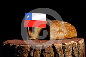 Chilean flag on a stump with bread