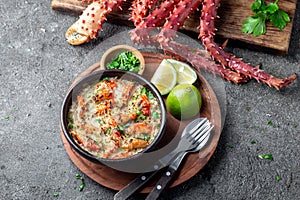 Chilean food. Baked crabmeat crab meat with cheese, cream and bread. Pastel o chupe de sentolla or king crab