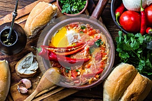 Chilean food. Picante caliente. Tomatoes, onion, chili fried with eggs photo