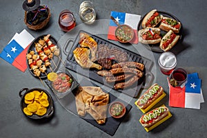 Chilean independence day table with traditional festive food for fiestas patrias. Dish and drink on 18 September party. photo