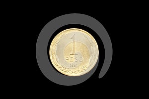 Chilean One Peso Coin Isolated On A Black Background