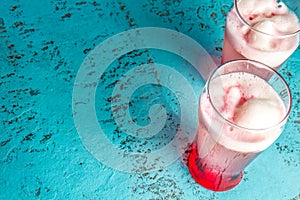 Chilean traditional alcoholic drink Terrremoto. with pineapple ice cream, liquor grenadine, pisco and white wine. Blue photo