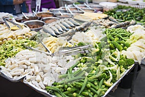 Chili with blanching vegetables in the market