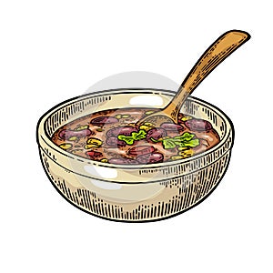 Chili con carne in bowl with spoon - mexican traditional food.