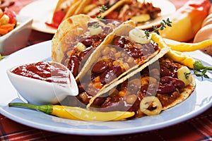 Chili con carne burrito in taco shell