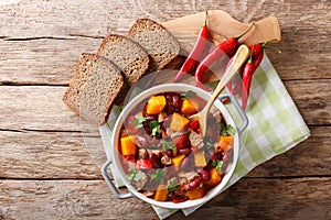 Chili con carne with pumpkin closeup in the pan. horizontal top