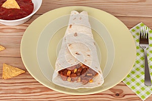 Chili Con Carne on tortilla wrap with salsa sauce and tortilla c