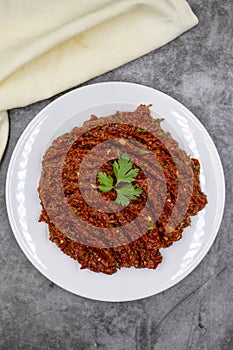 Chili paste on a dark background. spicy paste. A kind of adjika.