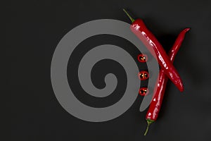 Chili pepper on a blackboard. Black and red. Abstraction. Minima