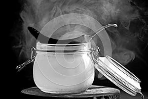 Chili pepper on a jar with smoke