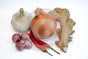 Chili pepper, onion , shallot, ginger and garlic isolated on white background.