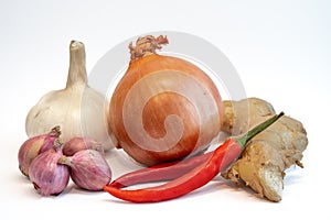 Chili pepper, onion , shallot, ginger and garlic isolated on white background.