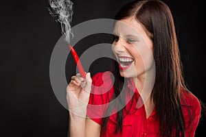 Chili pepper portrait young woman smoke red hot