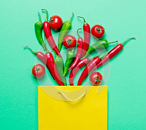 Chili pepper and shopping bag ant tomatoes