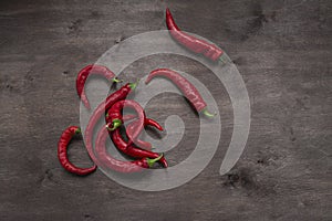 Chili pepper on a wooden background. Place for text