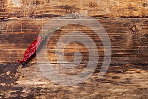 Chili pepper on wooden table