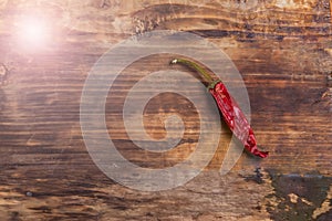 Chili pepper on wooden table