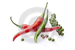 Chili peppers with fresh black peper on a white
