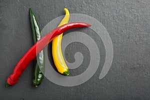 Chili peppers on a slate stone slab