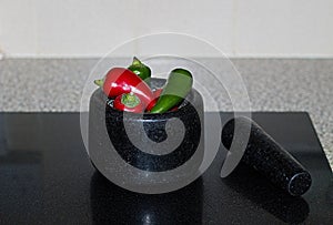 Fresh Raw Chili Peppers In A Stone Mortar & Pestle