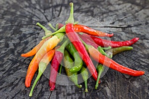 Chili peppers on wooden background