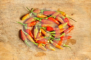Chili peppers on wooden background