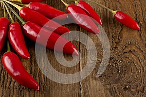 Chili peppers on a wooden table