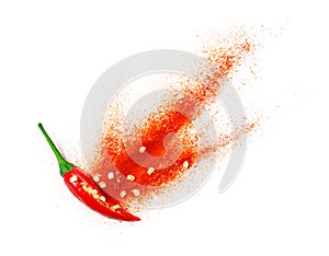Chili powder bursting out of a cut open chili pepper