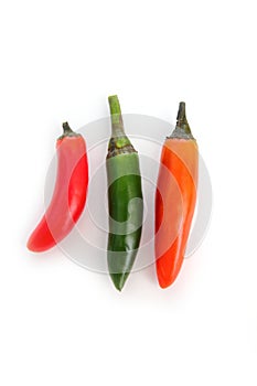 Chili serrano isolated on white green red orange photo