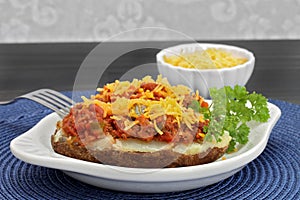 Chili stuffed baked potato