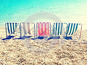 Chill on beach with retro stripes sun bed photo