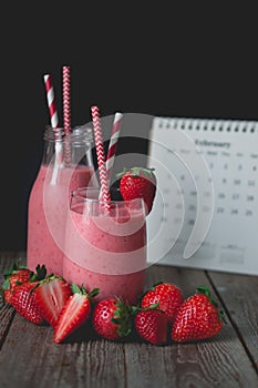 chill and relax time with strawberry smoothie with wood background and copy space