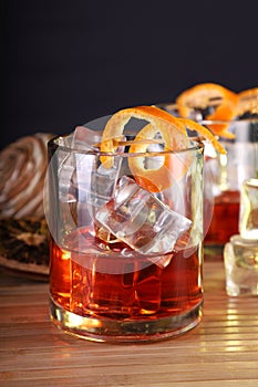 Chilled Alcohol Whisky / Rum Drink with Ice Cube and Orange Peel