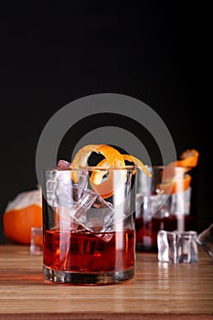 Chilled Alcohol Whisky / Rum Drink with Ice Cube and Orange Peel