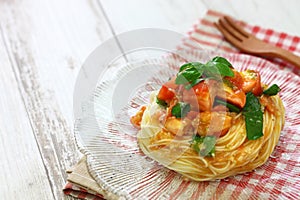 Chilled capellini with fresh tomatoes and basil