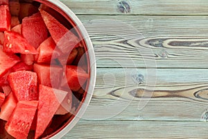 Chilled metal bowl full of diced watermelon